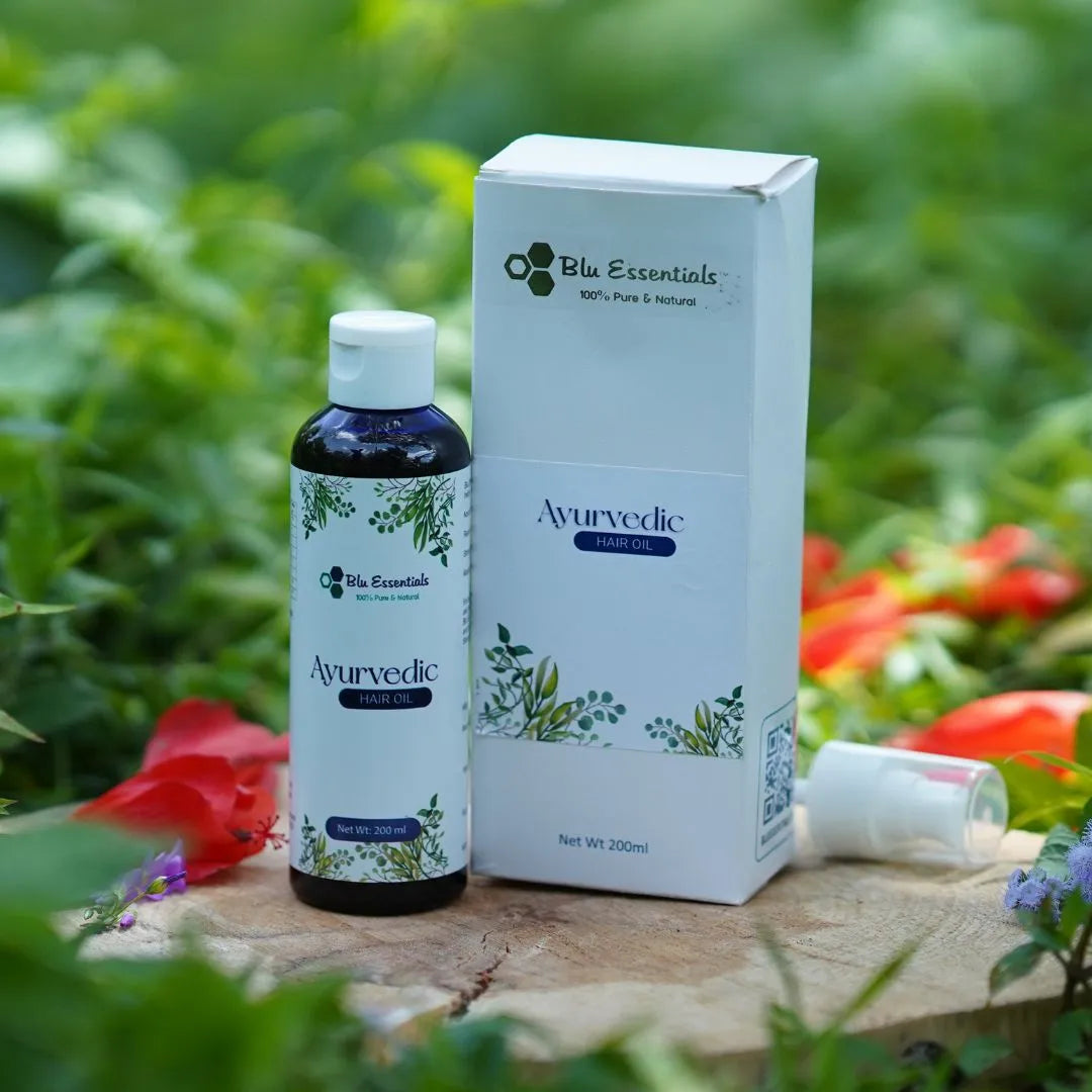 Blu Essentials Ayurvedic Hair Oil in a 200mL bottle, ideal for hair fall and positive growth, featuring natural ingredients.