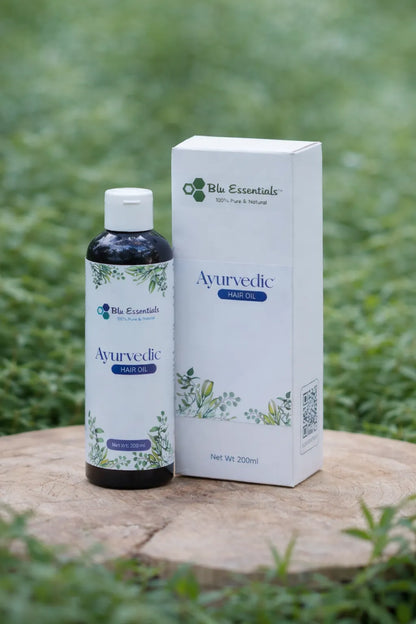 Blu Essentials Ayurvedic Hair Oil in a 200mL bottle, ideal for hair fall and positive growth, featuring natural ingredients.