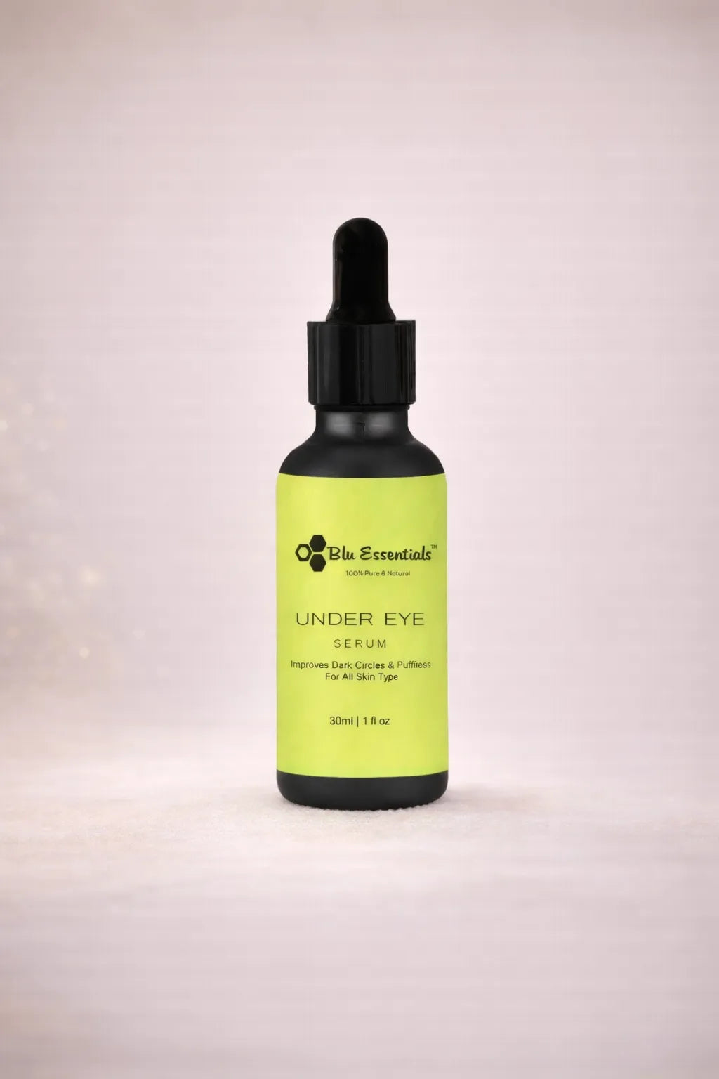 Blu Essentials Under Eye Serum 30ml in a sleek bottle, featuring natural ingredients like Aloe Vera and Green Tea for skin...